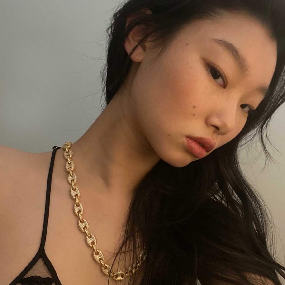 model wearing blegati gold necklace, iced out chain
